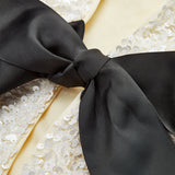 Lavinia | Textured Sequin Jacket with Velvet Bow Detail
